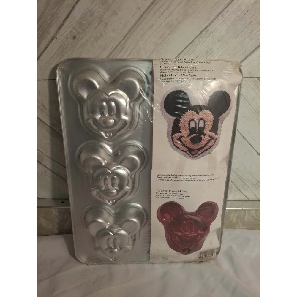 Mickey Mouse Mini Pan For Cakes. New . In Factory Seal. 6 shapes on pan.